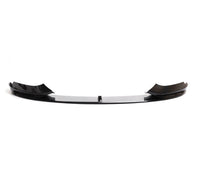 Load image into Gallery viewer, A glossy black car front bumper lip spoiler with a polished chrome center bar, shown against a plain white background.
