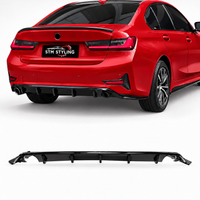 Load image into Gallery viewer, A black rear diffuser spoiler lip shown both installed on the rear of a red sedan and as a standalone product on a white background. The license plate on the car reads STM STYLING.
