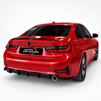 Load image into Gallery viewer, A red sedan shown from the rear three-quarter angle on a clean white studio background, with a black rear diffuser and a visible 'STM STYLING' badge on the trunk.
